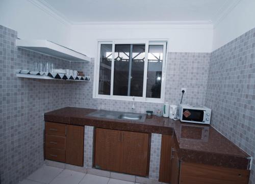 Η κουζίνα ή μικρή κουζίνα στο Haven Hearts Apartments