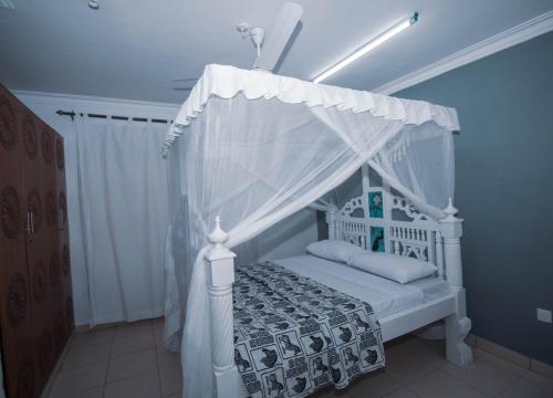 Ένα ή περισσότερα κρεβάτια σε δωμάτιο στο Haven Hearts Apartments