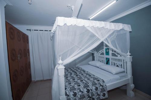 Säng eller sängar i ett rum på Haven Hearts Apartments