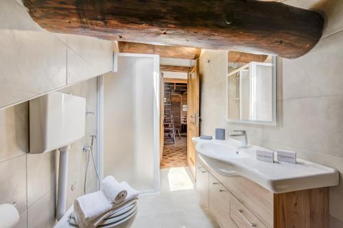 a bathroom with a sink and a toilet at Arianna - Happy Rentals in Livigno