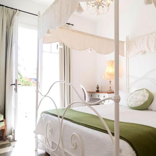 Postel nebo postele na pokoji v ubytování Villa Vicuña Salta Hotel Boutique