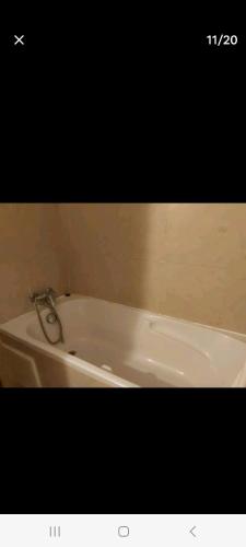 a picture of a bath tub in a bathroom at Appartement avec piscine proche de la plage in Mohammedia