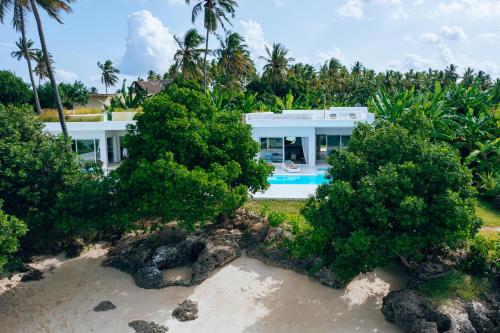 an aerial view of a house on the beach at Y Residential Luxury Villas in Dikoni