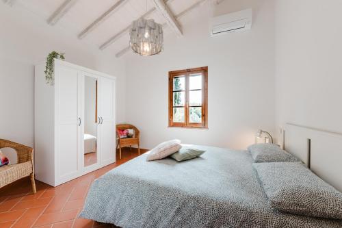 Postel nebo postele na pokoji v ubytování Tognazzi Casa Vacanze - Panoramic Villa