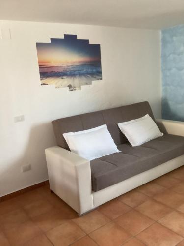 a bed with two pillows on it in a room at Capricornio Club Diffuso in Maiori