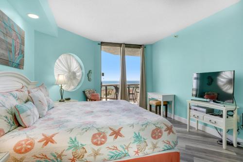 a bedroom with a bed with a view of the ocean at Surfside Resort #309 in Destin