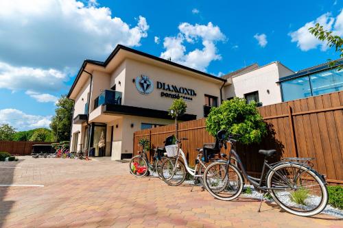 a group of bikes parked in front of a building at Diamond Panzió in Hajdúszoboszló