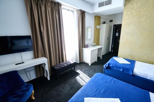 Katil atau katil-katil dalam bilik di Hotel Evianne Boutique