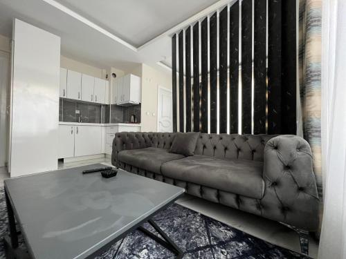 a living room with a couch and a table at Tower352 in Melikgazi