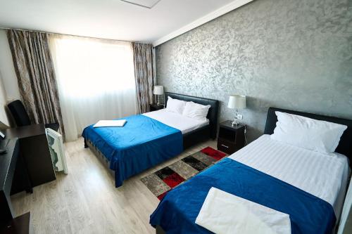 Katil atau katil-katil dalam bilik di Hotel Evianne Boutique