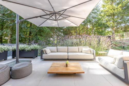 Zona de estar de Villa Wood - Gîte de prestige en Ardennes - 10 personnes - Sauna, jacuzzi, piscine et billard
