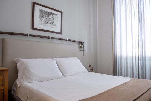 Una cama o camas en una habitación de Ai Vicerè