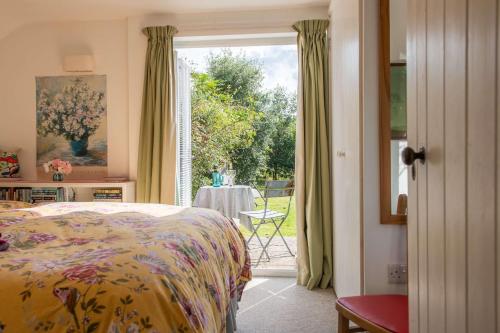 Postel nebo postele na pokoji v ubytování The Potting Shed