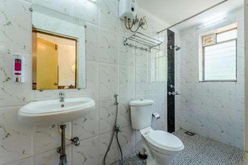 a bathroom with a toilet and a sink at Paradiso Villa -2BHK villa with Pool-Vagator By StayMonkey in Vagator