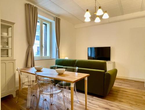 a living room with a couch and a table at Palazzo Pitagora in Taranto