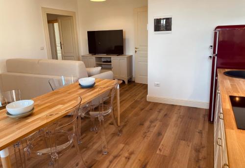 a living room with a table and a couch at Palazzo Pitagora in Taranto