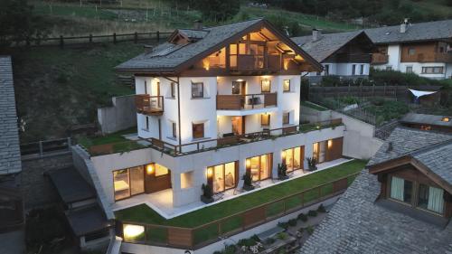 an aerial view of a house with lights on at BORMIO N'JOY in Bormio