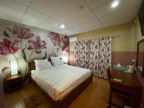 Voodi või voodid majutusasutuse Little Italy Hotel toas