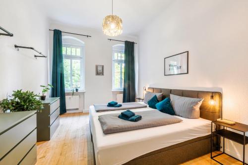 a bedroom with two beds and a bathroom at unique Malterstraße feel-good-home - Dresden in Dresden