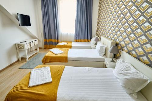 Katil atau katil-katil dalam bilik di Hotel Evianne Boutique
