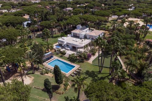 an aerial view of a house with a swimming pool at Villa Natura by Algarve Holidays in Vilamoura