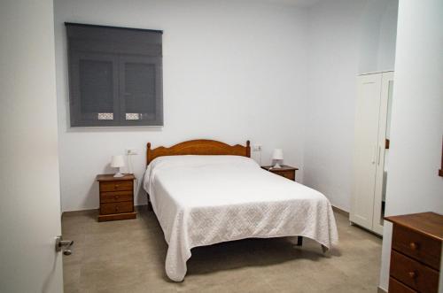 Katil atau katil-katil dalam bilik di Casa vacacional El Sol