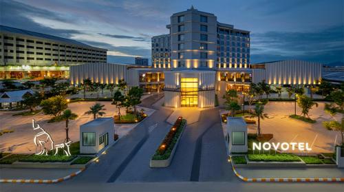 a rendering of a building in a city at night at Novotel Rayong Star Convention Centre in Rayong
