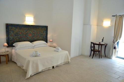 Letto o letti in una camera di Masseria Palane