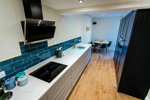 a kitchen with a sink and a counter top at Tyne Square North Shields - historic property - dog friendly in North Shields