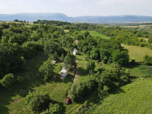 an aerial view of a house in a field with trees at Rtanj hotel sa 1000 zvezdica 2 in Vrmdža