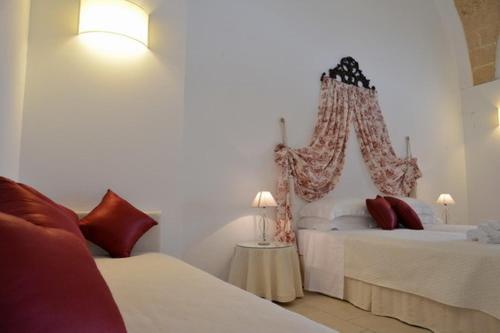 Letto o letti in una camera di Masseria Palane