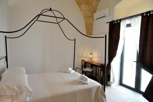 Letto o letti in una camera di Masseria Palane