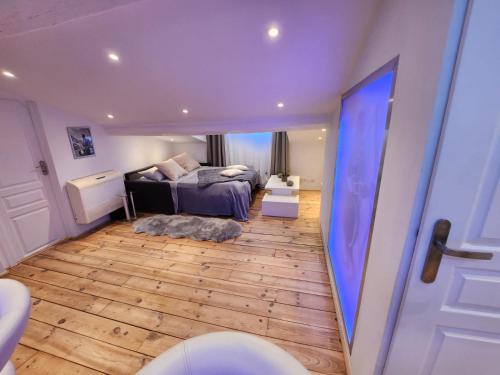 a bedroom with a bed and a wooden floor at Le Croisette center in Cannes