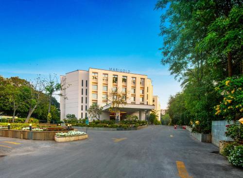 an empty street in front of a building at Marigold Hotel in Hyderabad