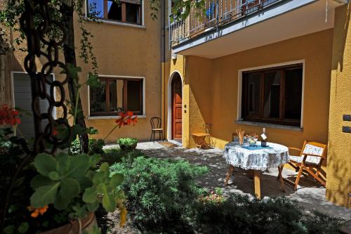 a courtyard of a house with a table and chairs at Menaggio 57 in Menaggio