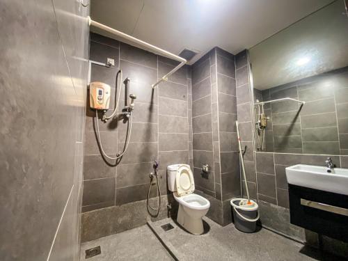 a bathroom with a shower and a toilet and a sink at ED Studio 34@DPAC/IKEA/1 Utama/TTDI in Petaling Jaya