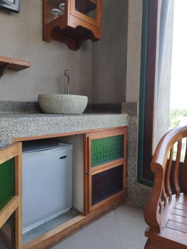 a kitchen with a sink and a counter top with a sink at Dalem Arum (for women only) in Bandung
