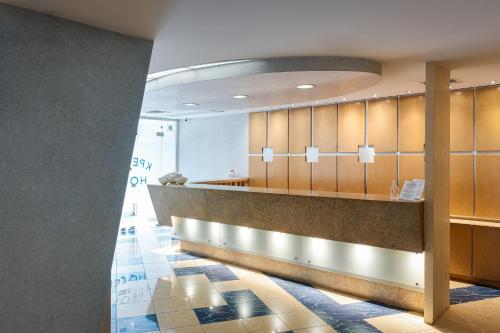 a waiting room at a hospital with a counter at Kreoli Suites Glyfada in Athens