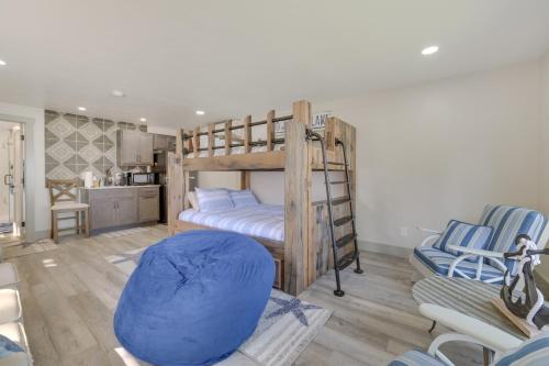 a bedroom with a bunk bed with a blue bean bag chair at Higgins Lake House and Bunkhouse with Private Dock! in Roscommon