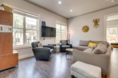 a living room with a couch and a tv at Modern Home Less Than 1 Mi to Dwtn San Antonio and Riverwalk in San Antonio