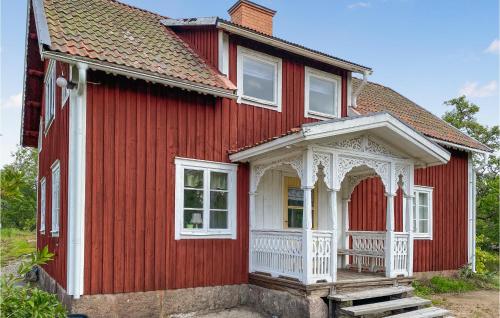 a red house with a white gazebo at 4 Bedroom Beautiful Home In Vimmerby in Vimmerby