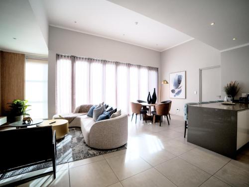 a living room with a couch and a table at Masingita Towers Hotel and SPA in Johannesburg