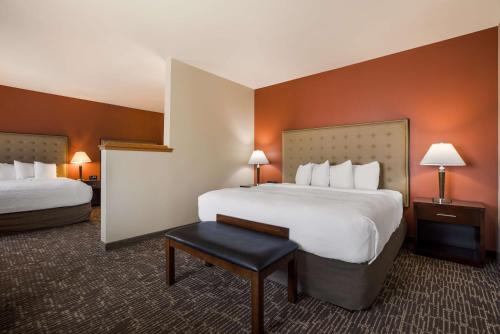 a hotel room with two beds and a table at Best Western Northwest Lodge in Boise