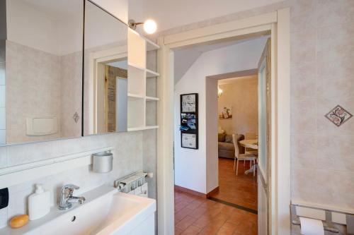 a bathroom with a sink and a mirror at Ca' a riga in Diano Castello