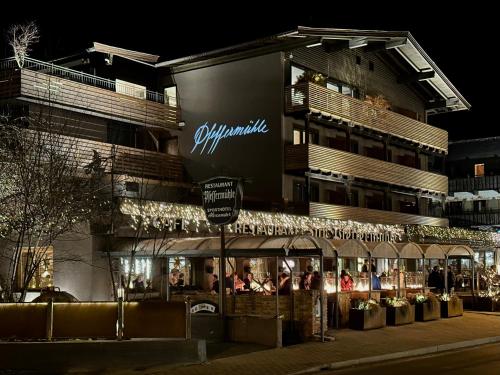 a store front of a building at night at Hotel Alexander in Kirchberg in Tirol