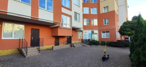 an apartment building with a courtyard in front of it at Apartment Buiucani in Chişinău
