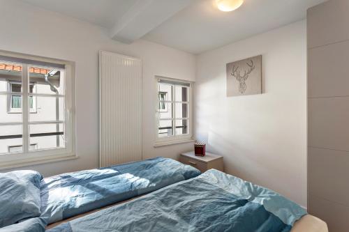 a bedroom with a bed and a window at alter Speicher in Warendorf