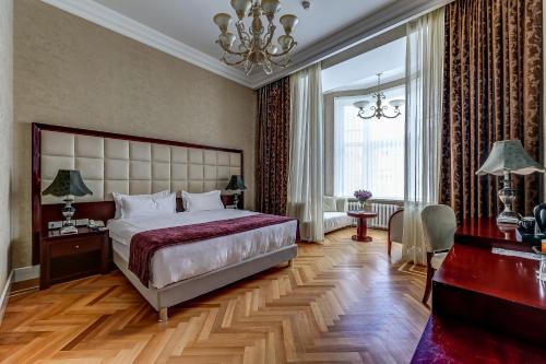 A bed or beds in a room at Akyan St.Petersburg