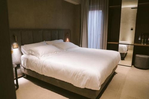 En eller flere senge i et værelse på VILLA GRUMOLARA