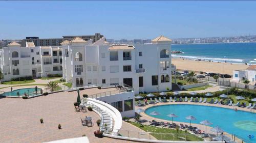 a view of a resort with a water slide at Beautiful apartment with SEAVIEW Malabata in Tangier